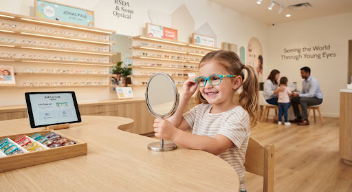 Child trying colourful eyewear